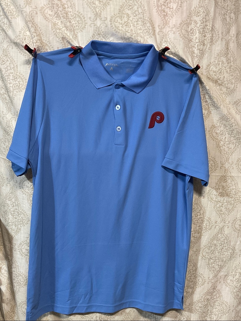 Antigua Men’s Sky Blue Polo with Red Phillies Logo